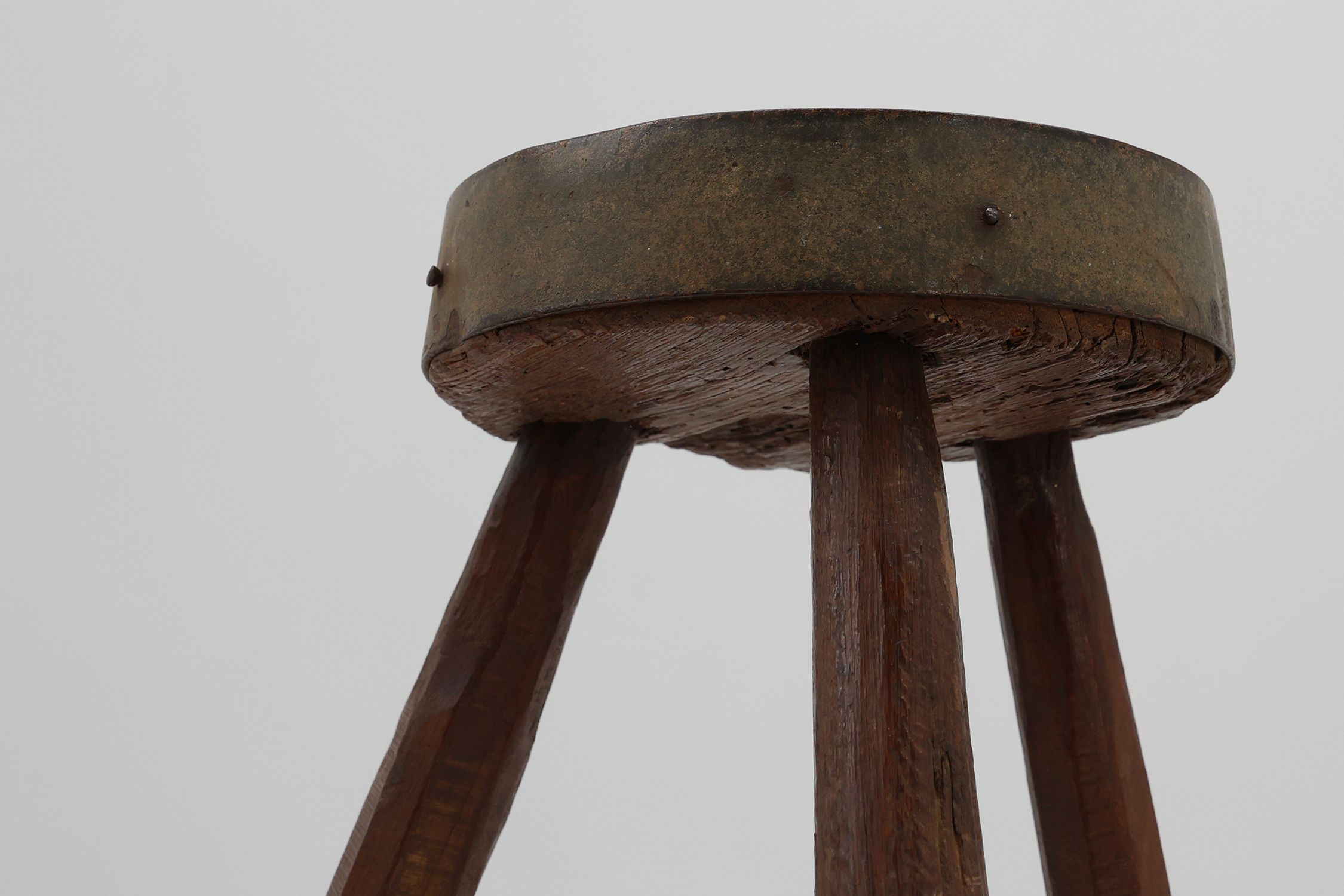 Brutalist French 1850s solid oak tripod stools with metal rim, set of 4thumbnail